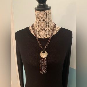 Purple beaded necklace with embossed aluminum accent